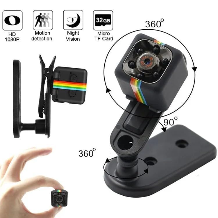 Black adjustable dash cam with a rainbow accent stripe, shown with a mounting clip, a hand holding the small camera for scale, and feature icons for HD 1080P, motion detection, night vision, and 32GB Micro TF Card. Diagrams indicate 360-degree rotation.