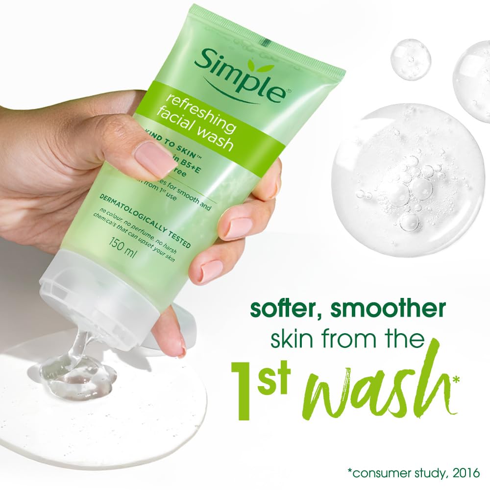 Hand holding a tube of Simple refreshing facial wash with product application and bubbles shown.